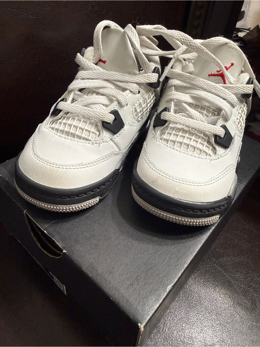Nike Kids White Sneakers with Black Soles and Red Jumpman